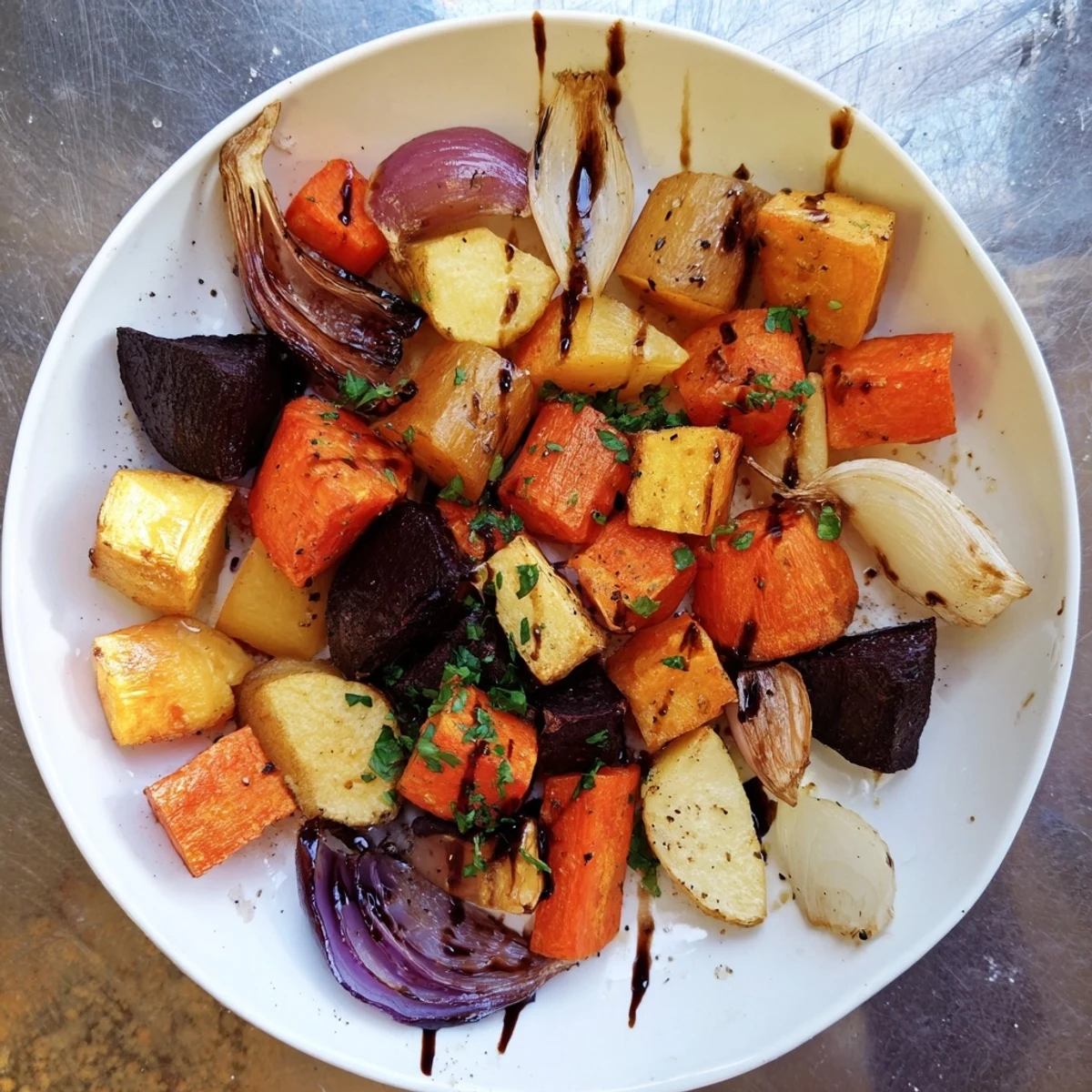 Golden-brown Roasted Root Vegetable Medley glistening with a sweet balsamic glaze, ready to serve.
