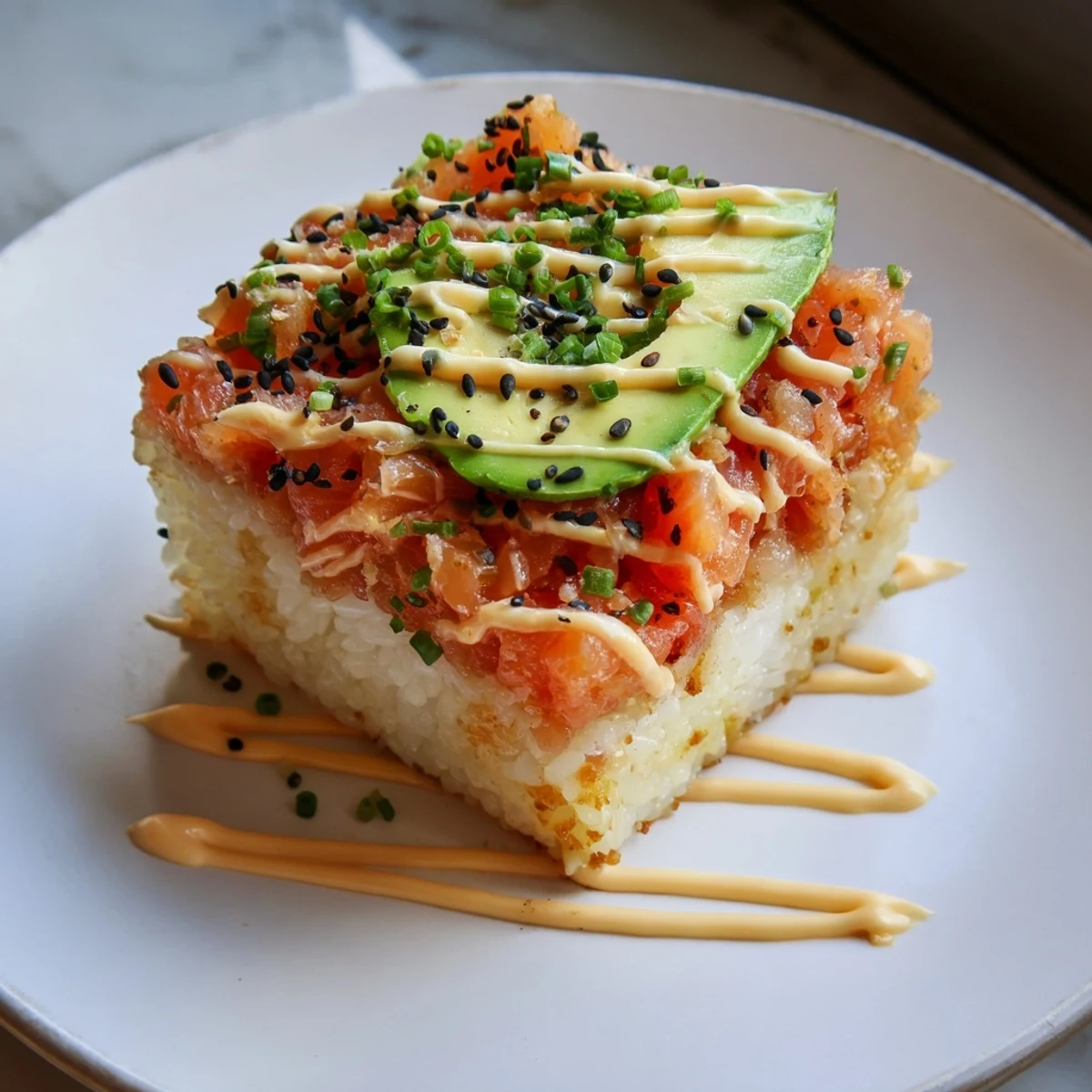 This delicious Crispy Rice Salmon Stack is layered with fresh avocado and vibrant salmon.