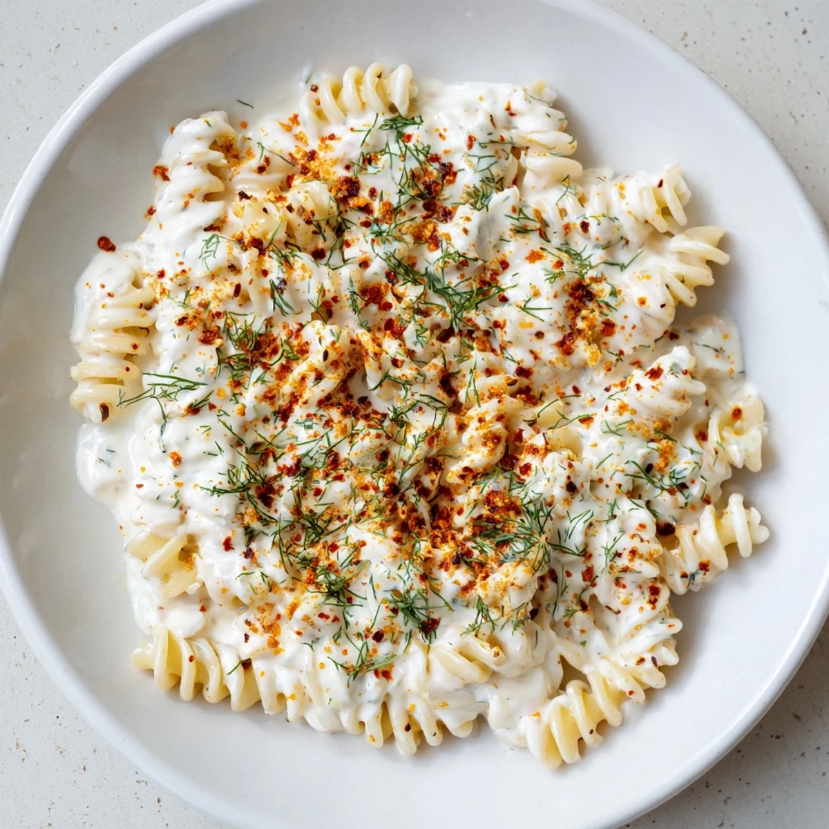 Creamy Turkish yogurt pasta, drizzled with spiced butter, is a delicious and easily prepared vegetarian meal.