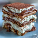 Hojicha Tiramisu dusted with cocoa powder, layered with creamy mascarpone and hojicha-soaked ladyfingers.