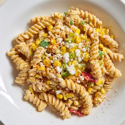 This one-pot Mexican Street Corn Pasta features perfectly cooked fusilli with a burst of fresh lime.
