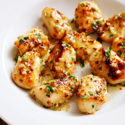 Sizzling Garlic Butter Chicken Bites, showcasing perfectly seared chicken coated in a rich sauce.
