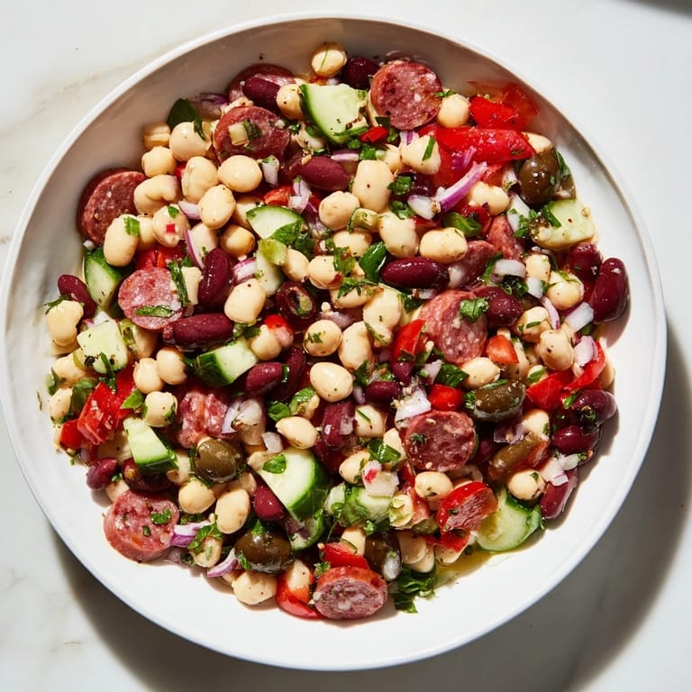 Bright and chunky Mediterranean Dense Bean Salad, a satisfying gluten-free meal bursting with savory flavors.