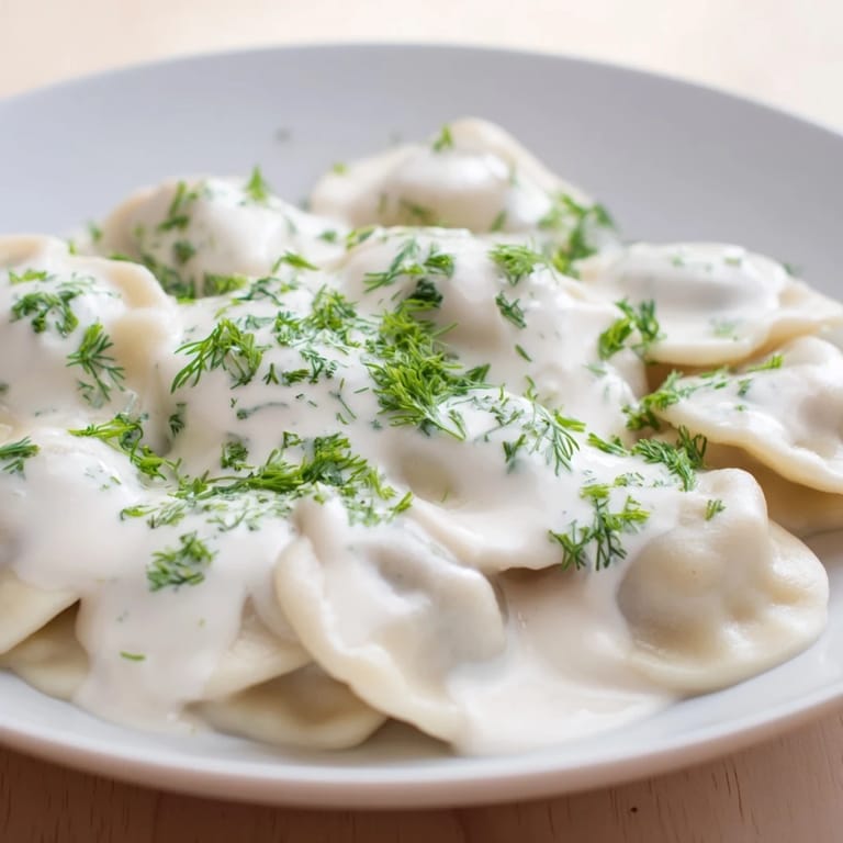 A close-up of golden, cooked Russian pelmeni, ready to be enjoyed as a hearty meal.