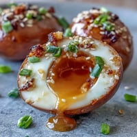 Spicy miso marinated eggs with soft-boiled yolks in a savory, umami-rich marinade.  